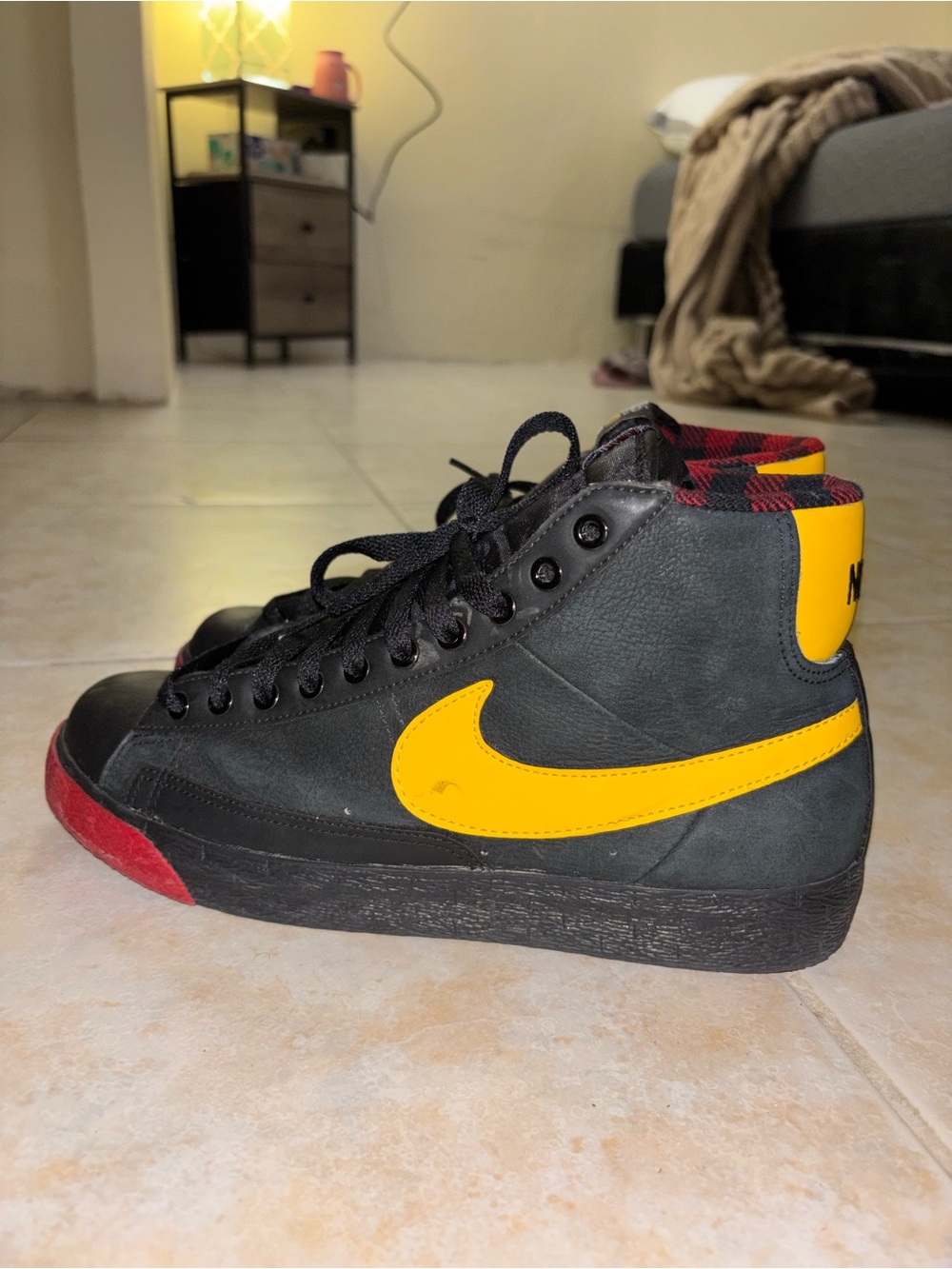 Nike Men’s Black High-Top Sneakers with Yellow Swoosh and Red Toe Accent